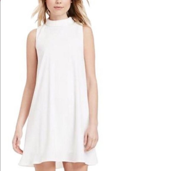 white sleeveless turtleneck dress